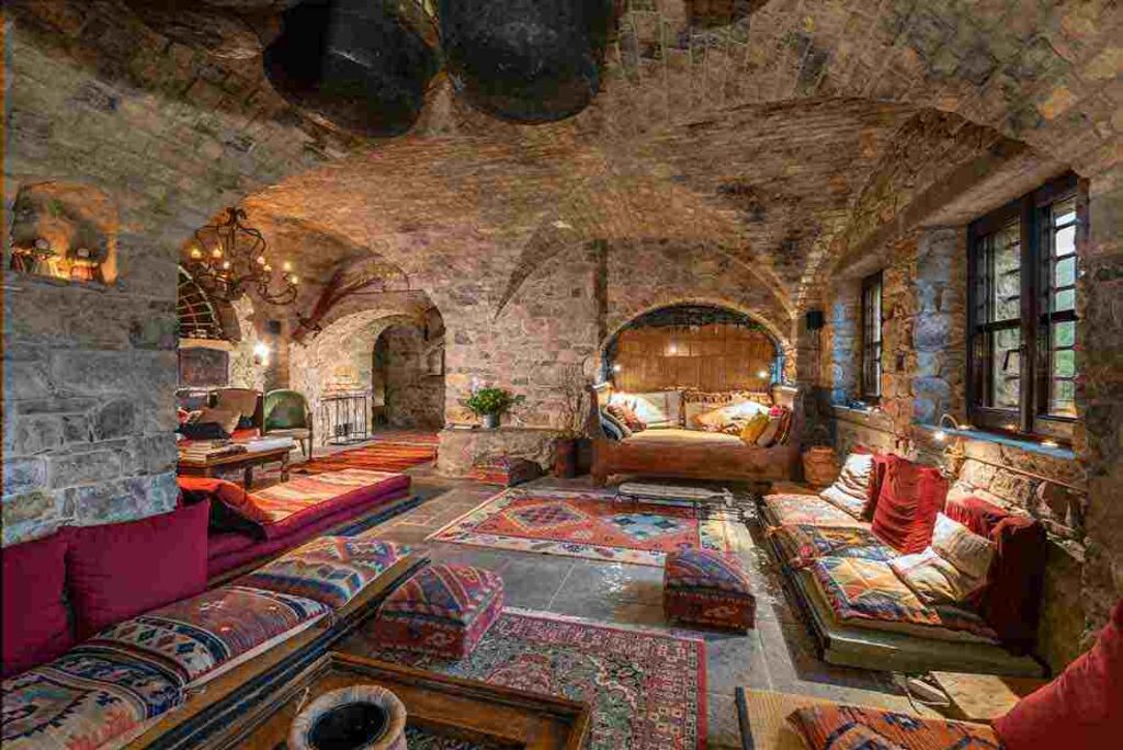 a room with a brick wall and a stone ceiling